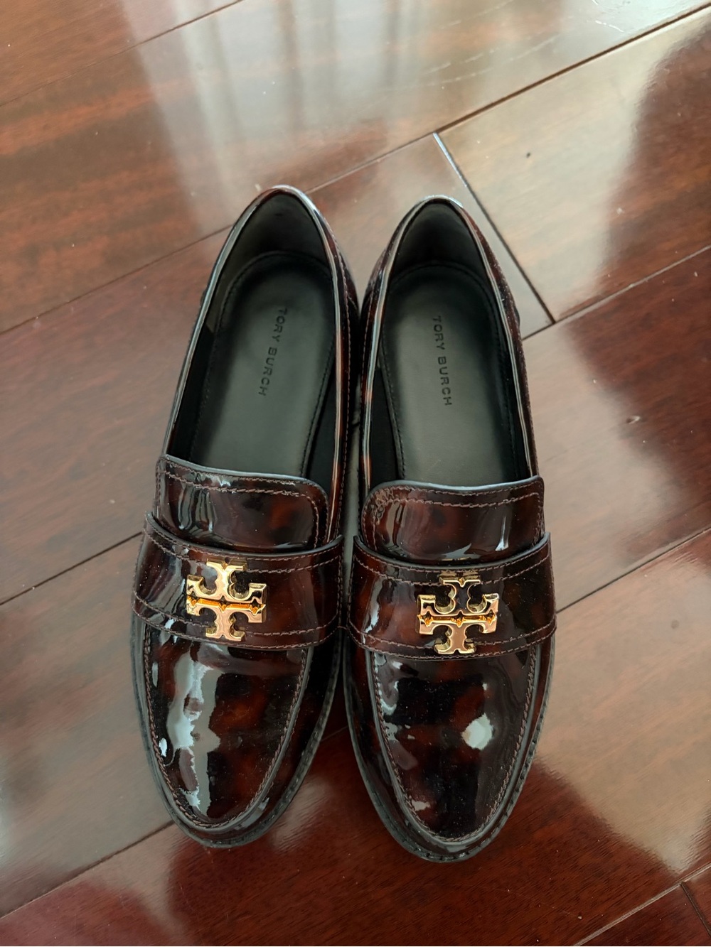 Tory Burch Women's Patent Leather Loafers in Dark Brown with Gold Logo